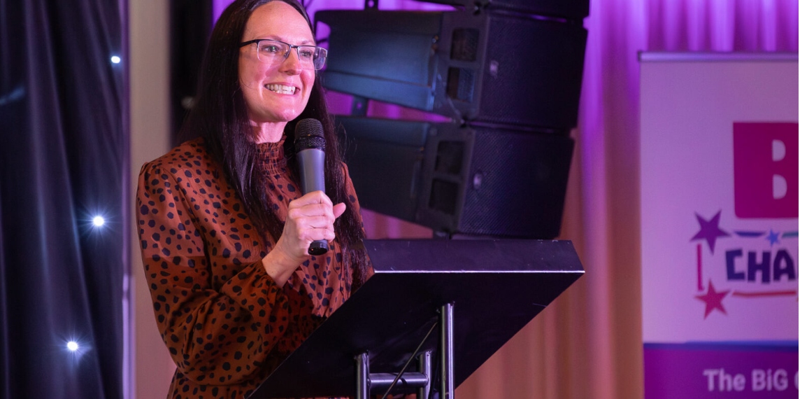 Stacey Jubb speaking on stage